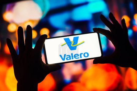Photo for January 4, 2023, Brazil. In this photo illustration, the Valero Energy Corporation logo is displayed on a smartphone screen - Royalty Free Image