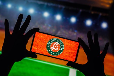 Photo for January 9, 2023, Brazil. In this photo illustration, the Roland-Garros (French Open) logo is displayed on a smartphone screen - Royalty Free Image