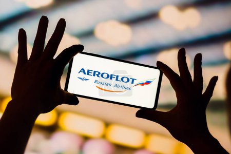 Téléchargez les photos : January 19, 2023, Brazil. In this photo illustration, the Aeroflot logo is displayed on a smartphone screen - en image libre de droit