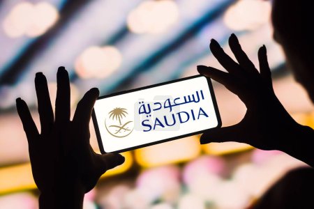 Photo for February 4, 2023, Brazil. In this photo illustration, the Saudia logo is displayed on a smartphone screen - Royalty Free Image