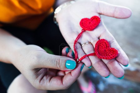 Photo for Woman crocheting. Hand craft work using crochet hook. Knitting heart - Royalty Free Image