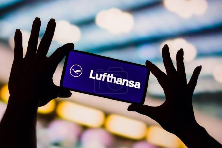 Photo for February 6, 2023, Brazil. In this photo illustration, the Deutsche Lufthansa AG logo is displayed on a smartphone screen - Royalty Free Image