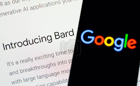 Photo for February 9, 2023, Brazil. In this photo illustration, the Google logo is displayed on a smartphone screen, in the background, the page of the new artificial intelligence (AI) tool called Bard - Royalty Free Image