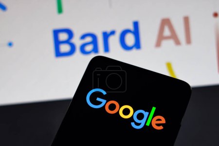 Photo for February 9, 2023, Brazil. In this photo illustration, the Google logo is displayed on a smartphone screen, in the background the Google Bard AI logo - Royalty Free Image