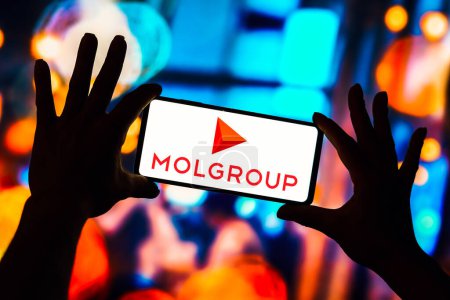 Foto de February 13, 2023, Brazil. In this photo illustration, the MOL Group logo is seen displayed on a smartphone - Imagen libre de derechos