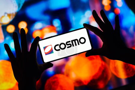 Photo for February 15, 2023, Brazil. In this photo illustration, the Cosmo Energy Holdings logo is seen displayed on a smartphone - Royalty Free Image