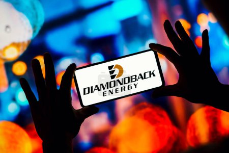 Photo for February 15, 2023, Brazil. In this photo illustration, the Diamondback Energy logo is seen displayed on a smartphone - Royalty Free Image