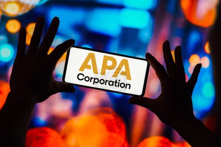 Photo for February 15, 2023, Brazil. In this photo illustration, the APA Corporation logo is seen displayed on a smartphone - Royalty Free Image