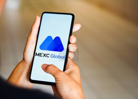 Foto de February 17, 2023, Brazil. In this photo illustration, the MEXC Global logo is seen displayed on a smartphone - Imagen libre de derechos