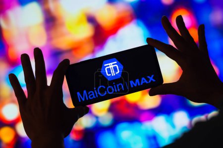 Photo for February 27, 2023, Brazil. In this photo illustration, the MaiCoin MAX Exchange logo seen displayed on a smartphone - Royalty Free Image