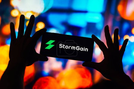 Photo for March 4, 2023, Brazil. In this photo illustration, the StormGain logo seen displayed on a smartphone - Royalty Free Image