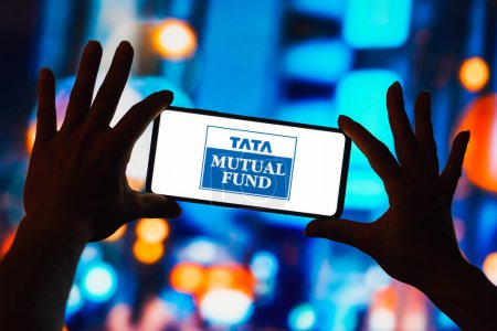 Photo for March 11, 2023, Brazil. In this photo illustration, the Tata Mutual Fund logo seen displayed on a smartphone - Royalty Free Image