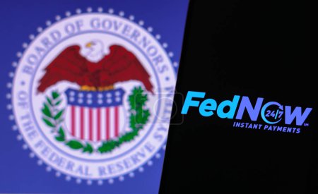 Photo for March 17, 2023, Brazil. In this photo illustration the FedNow Service (Instant Payments) logo seen displayed on a smartphone and Federal Reserve System of the United States - Royalty Free Image