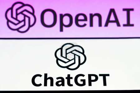 Photo for April 5, 2023, Brazil. In this photo illustration, the ChatGPT logo is seen displayed on a smartphone and background the OpenAI company logo - Royalty Free Image