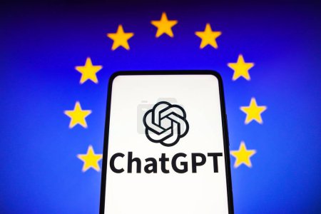 Photo for April 5, 2023, Brazil. In this photo illustration, the ChatGPT logo is seen displayed on a smartphone and the background the flag of the European Union - Royalty Free Image