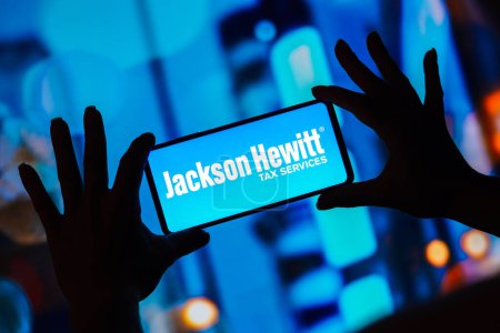 Photo for April 10, 2023, Brazil. In this photo illustration, the Jackson Hewitt Tax Service logo is displayed on a smartphone screen - Royalty Free Image