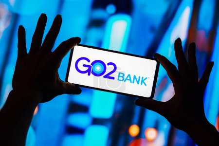 Photo for April 10, 2023, Brazil. In this photo illustration, the GO2 Bank logo is displayed on a smartphone screen - Royalty Free Image