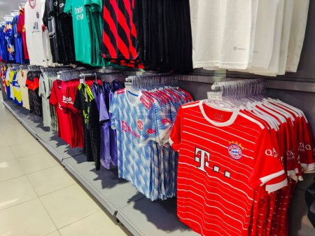 Photo for April 18, 2023, Paraguay. FC Bayern Mnchen and Manchester United shirts for sale at a sporting goods store in the city of Pedro Juan Caballero, Paraguay. - Royalty Free Image