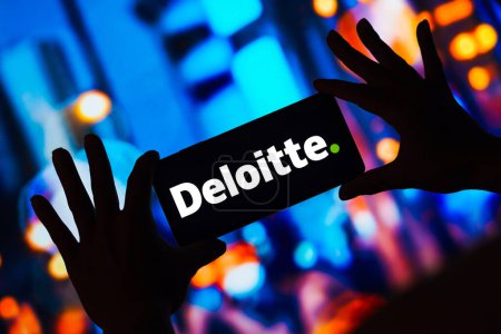 Photo for May 4, 2023, Brazil. In this photo illustration, the Deloitte Touche Tohmatsu Limited logo is displayed on a smartphone screen - Royalty Free Image
