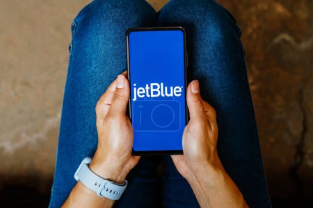Photo for June 3, 2023, Brazil. In this photo illustration, the JetBlue Airways logo is displayed on a smartphone screen - Royalty Free Image