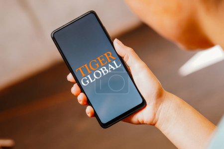 Photo for June 3, 2023, Brazil. In this photo illustration, the Tiger Global Management logo is displayed on a smartphone screen - Royalty Free Image
