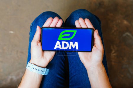 Photo for June 6, 2023, Brazil. In this photo illustration, the Archer Daniels Midland Company (ADM) logo is displayed on a smartphone screen - Royalty Free Image