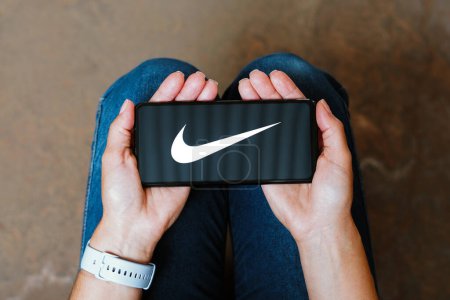 Photo for June 9, 2023, Brazil. In this photo illustration, the Nike, Inc. logo is displayed on a smartphone screen - Royalty Free Image