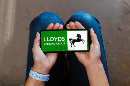 Photo for June 23, 2023, Brazil. In this photo illustration, the Lloyds Banking Group logo is displayed on a smartphone mobile screen - Royalty Free Image