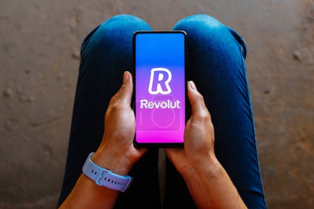 Photo for June 26, 2023, Brazil. In this photo illustration, the Revolut logo is displayed on a smartphone mobile screen - Royalty Free Image