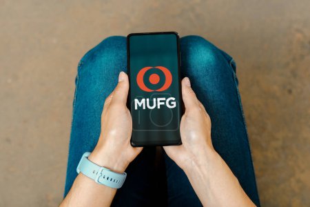 Photo for June 30, 2023, Brazil. In this photo illustration, the MUFG (Mitsubishi UFJ Financial Group) logo is displayed on a smartphone screen - Royalty Free Image