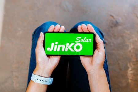 Photo for July 2, 2023, Brazil. In this photo illustration, the Jinko Solar logo is displayed on a smartphone screen - Royalty Free Image