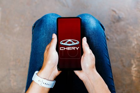 Photo for July 2, 2023, Brazil. In this photo illustration, the Chery Automobile logo is displayed on a smartphone screen - Royalty Free Image
