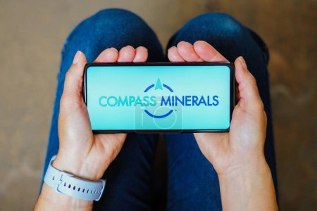 Photo for July 5, 2023, Brazil. In this photo illustration, the Compass Minerals International logo is displayed on a smartphone screen - Royalty Free Image