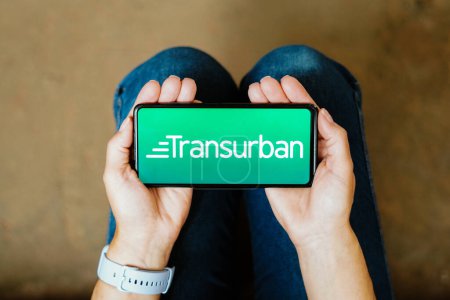 Foto de July 19, 2023, Brazil. In this photo illustration, the Transurban logo seen displayed on a smartphone - Imagen libre de derechos