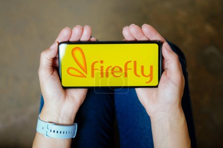 Téléchargez les photos : July 20, 2023, Brazil. In this photo illustration, the Firefly logo seen displayed on a smartphone - en image libre de droit