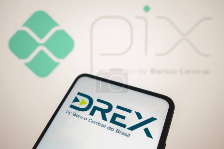 Photo for August 8, 2023, Brazil. In this photo illustration, the Drex logo seen displayed on a smartphone. Drex is the new Brazilian digital currency launched by the Central Bank. In the background the PIX logo - Royalty Free Image