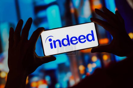 Photo for October 18, 2023, Brazil. In this photo illustration, the Indeed logo is displayed on a smartphone screen - Royalty Free Image