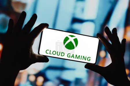 Photo for December 4, 2023, Brazil. In this photo illustration, the Xbox Cloud Gaming logo is displayed on a smartphone screen - Royalty Free Image