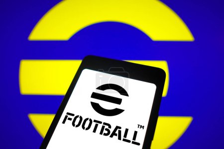Photo for February 5, 2024, Brazil. In this photo illustration, the EFootball logo is displayed on a smartphone screen and in the background - Royalty Free Image