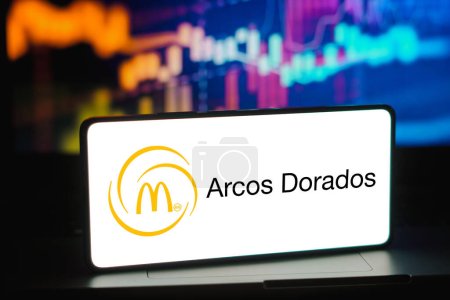 Photo for February 8, 2024, Brazil. In this photo illustration, the Arcos Dorados Holdings logo is displayed on a smartphone screen - Royalty Free Image