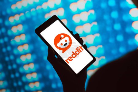 Photo for February 24, 2024, Brazil. In this photo illustration, the Reddit logo is displayed on a smartphone screen - Royalty Free Image