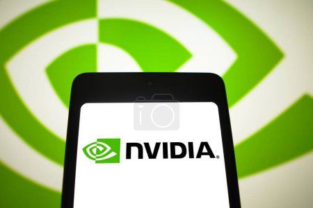 Photo for February 24, 2024, Brazil. In this photo illustration, the Nvidia Corporation logo is displayed on a smartphone screen and in the background - Royalty Free Image