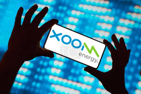 Photo for February 27, 2024, Brazil. In this photo illustration, the XOOM Energy logo is displayed on a smartphone screen - Royalty Free Image