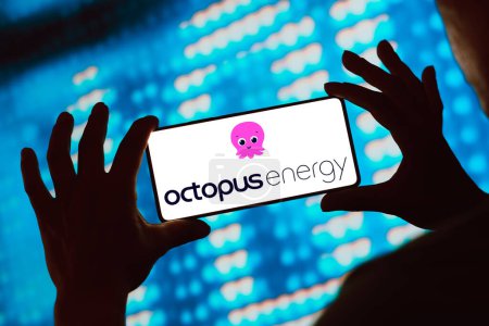 Photo for February 27, 2024, Brazil. In this photo illustration, the Octopus Energy Group logo is displayed on a smartphone screen - Royalty Free Image