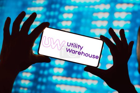 Photo for February 27, 2024, Brazil. In this photo illustration, the Utility Warehouse (UW) logo is displayed on a smartphone screen - Royalty Free Image