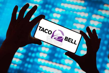 Photo for February 29, 2024, Brazil. In this photo illustration, the Taco Bell logo is displayed on a smartphone screen - Royalty Free Image
