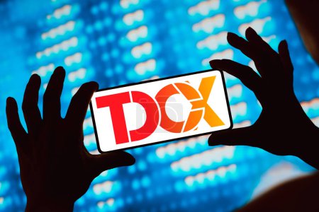 Photo for March 4, 2024, Brazil. In this photo illustration, the TDCX logo is displayed on a smartphone screen - Royalty Free Image