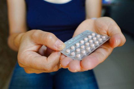 Photo for March 16, 2024, Brazil. A woman holds her birth control pill. The medication is a pill that contains a combination of hormones, usually synthetic estrogen and progesterone, that inhibit ovulation - Royalty Free Image