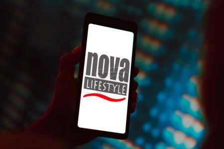 Photo for March 22, 2024, Brazil. In this photo illustration, the Nova Lifestyle, Inc. logo is displayed on a smartphone screen - Royalty Free Image