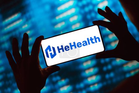 Photo for March 28, 2024, Brazil. In this photo illustration, the HeHealth logo is displayed on a smartphone screen - Royalty Free Image